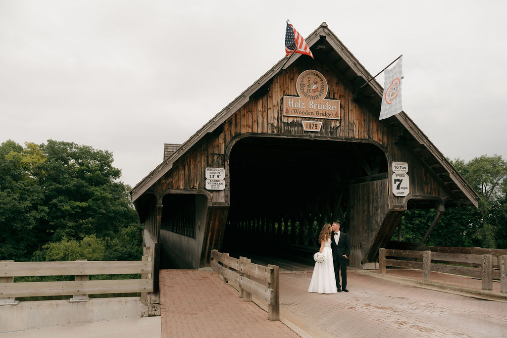 wedding portraits at the covered bridge in frankenmuth michigan