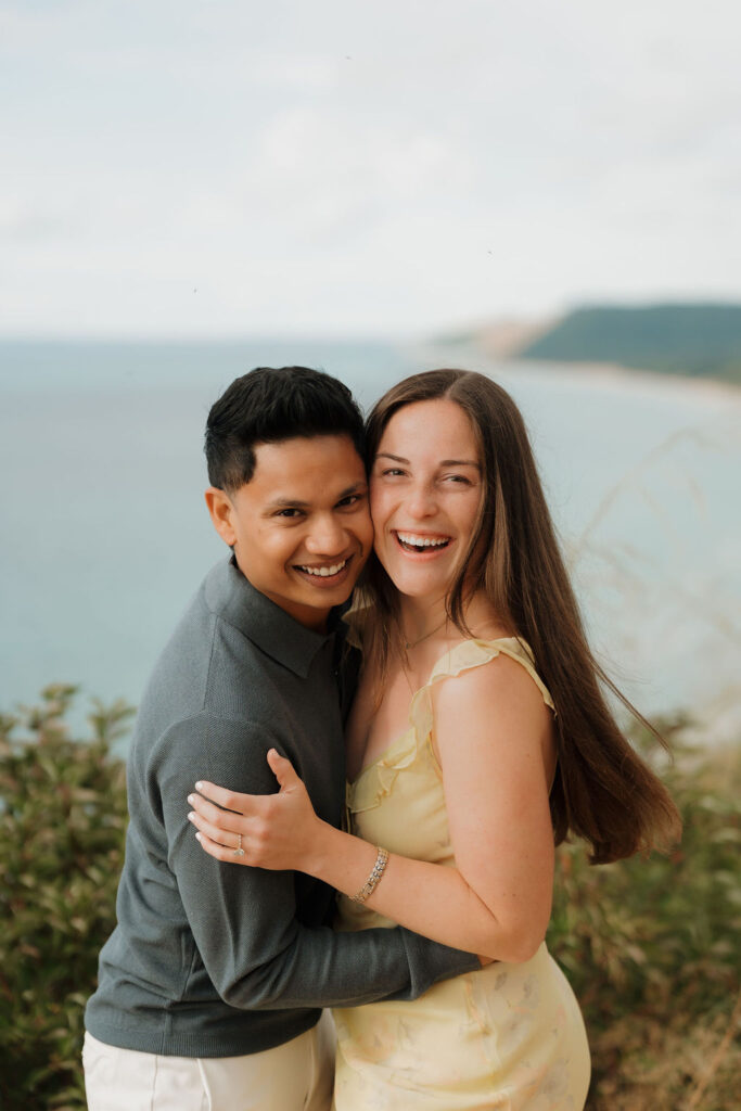 Close up photo of a couple smiling at Empire Bluff.