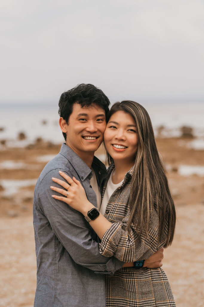 Close up of a couple smiling for their their Traverse City Michigan proposal photos.