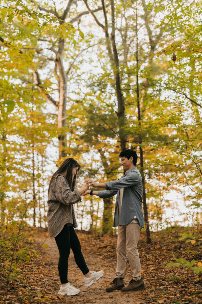 Couple holding hands along the trails near Old Mission Lighthouse.