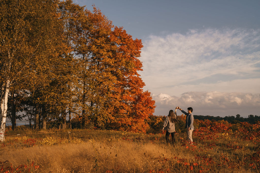 Couple dancing in an open field at The Overlook in Traverse City Michigan.
