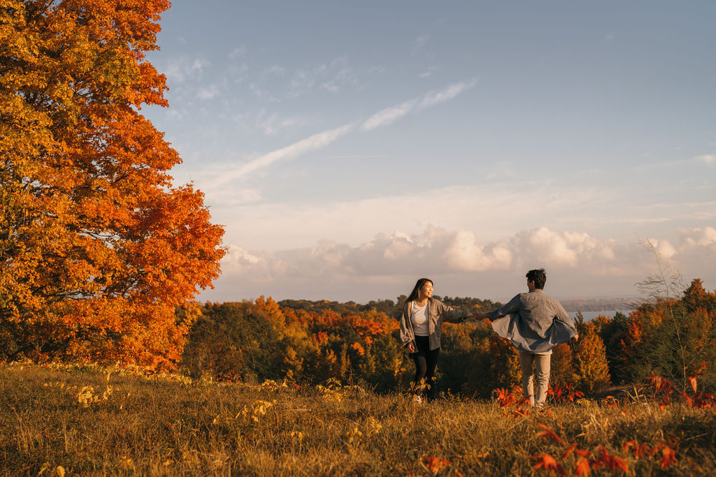 Couple dancing in the open field at The Overlook in Traverse City, Michigan during the fall.