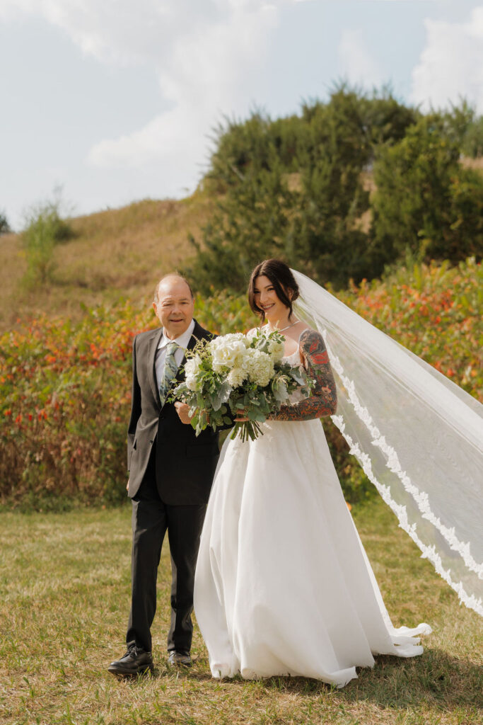 Bride walking down the aisle towards her soon-to-be-husband for the first time