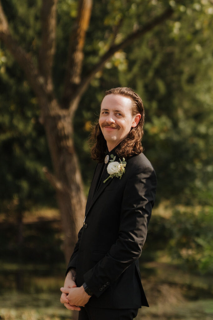 groom's first look at his soon-to-be wife walking down the aisle at their brooklyn wedding ceremony