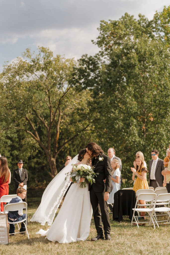 bride and groom walking down the aisle at their micro wedding in Brooklyn Mi