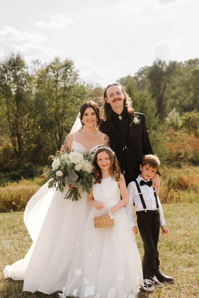 family photos after the ceremony and before the reception in the hills of mi