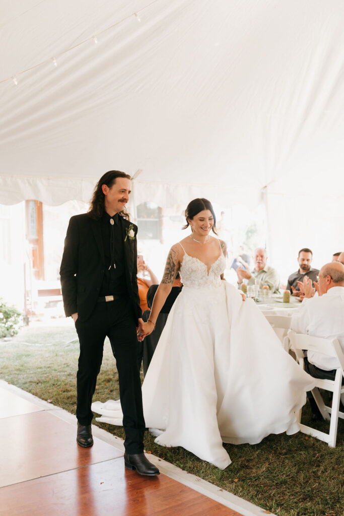 bride and groom entering their intimate family reception at brooklyn wedding