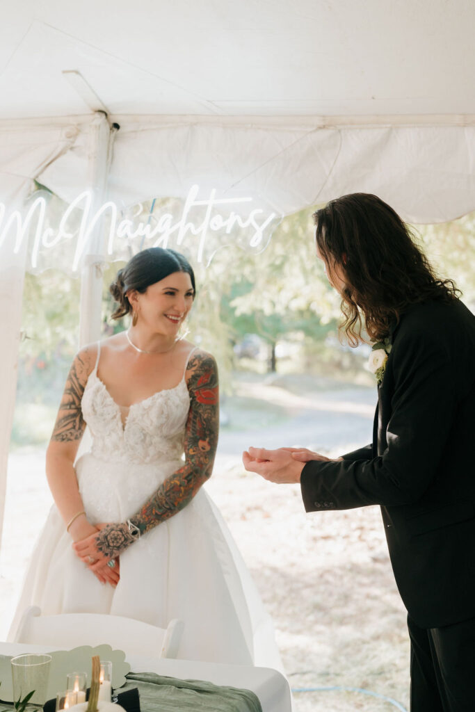 bride and groom getting ready to cut the cake at their wedding reception