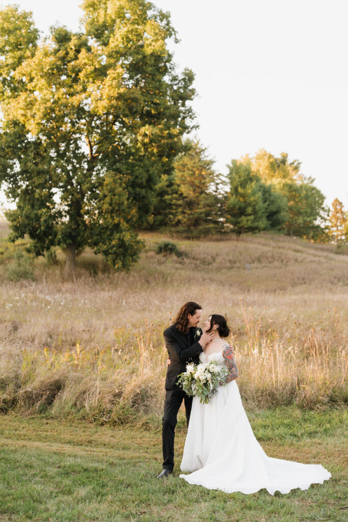 bride and groom looking lovingly at each other during their editorial photos after their ceremony
