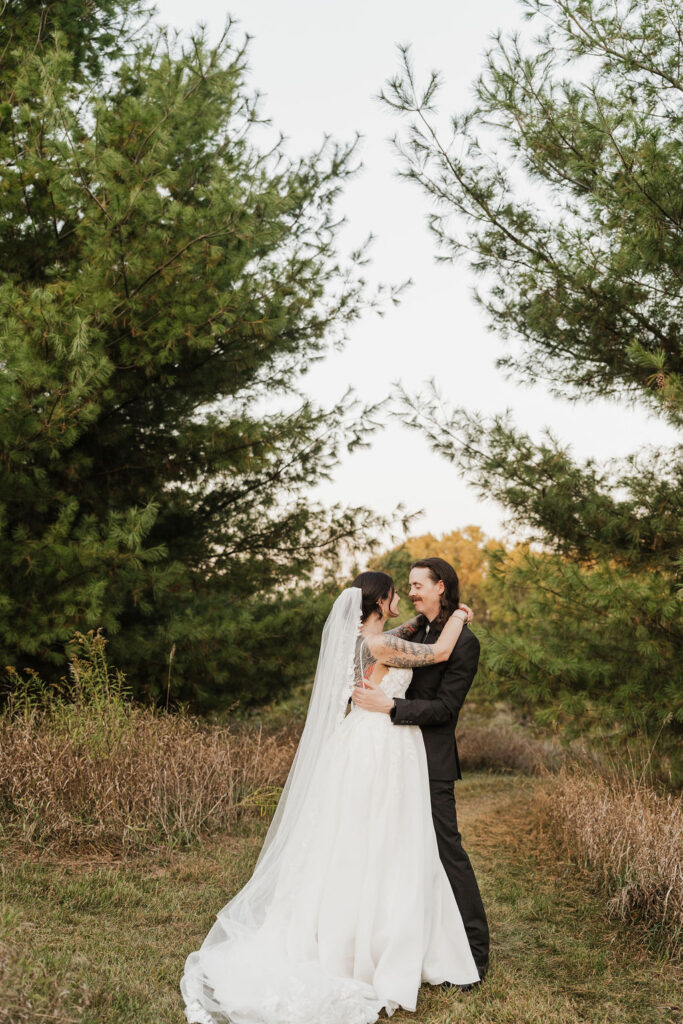 groom looking down at his bride happily after their wedding