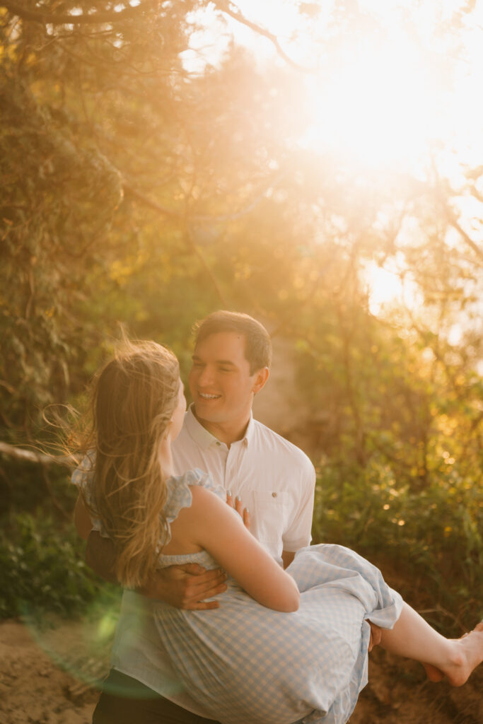 bride and groom celebrating their engagement at sleeping bear dunes